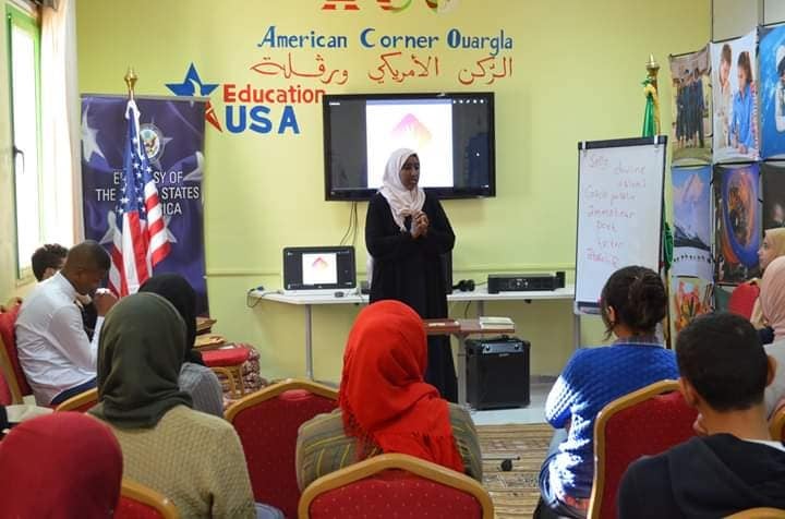 Bouchra Messaoudi speaks to fellow students in a classroom.