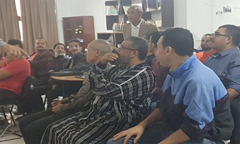 Moroccan artisans talking together in a meeting. 